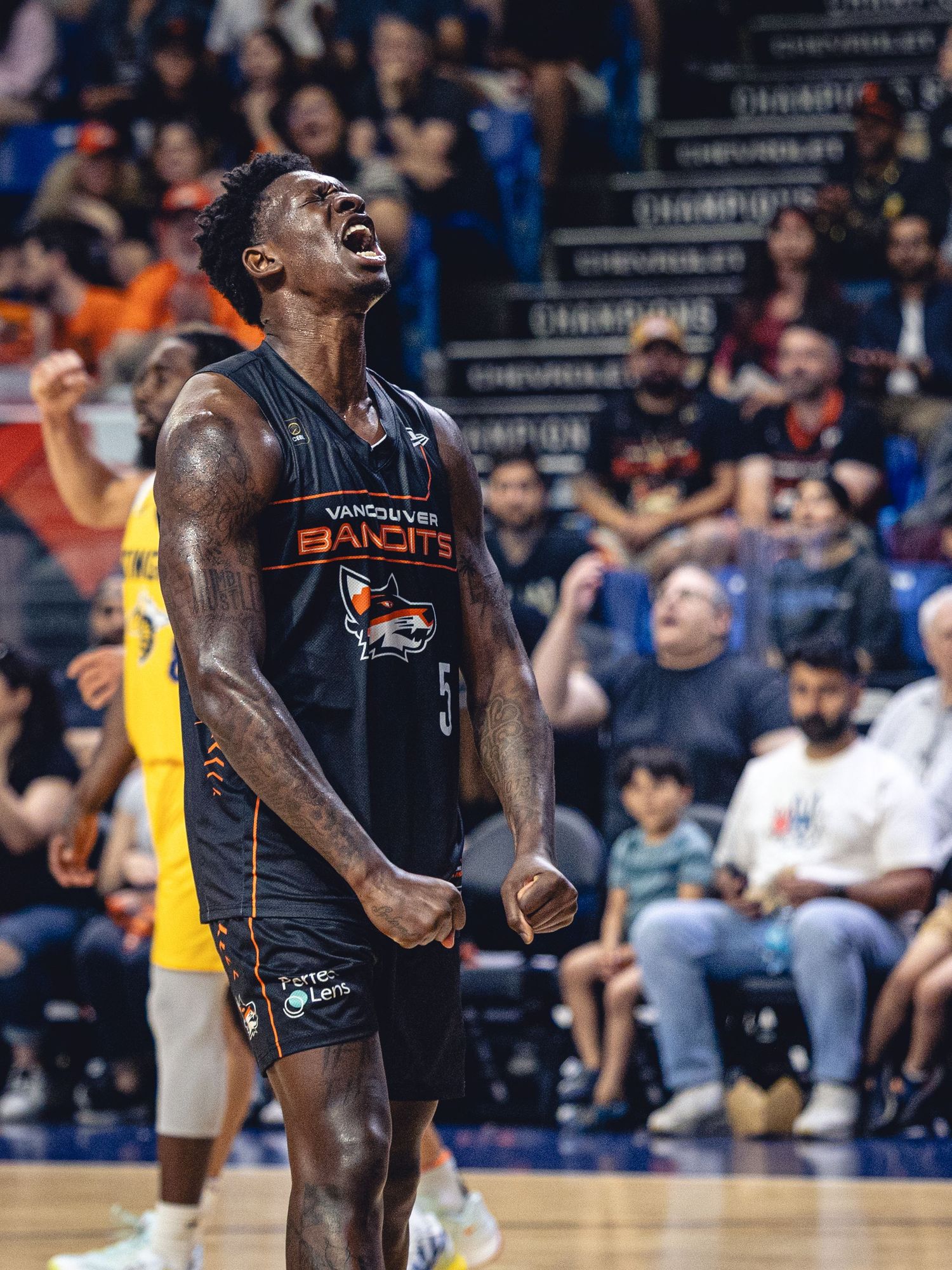 Vancouver Bandits basketball player #5 celebrates intensely on court during a game.