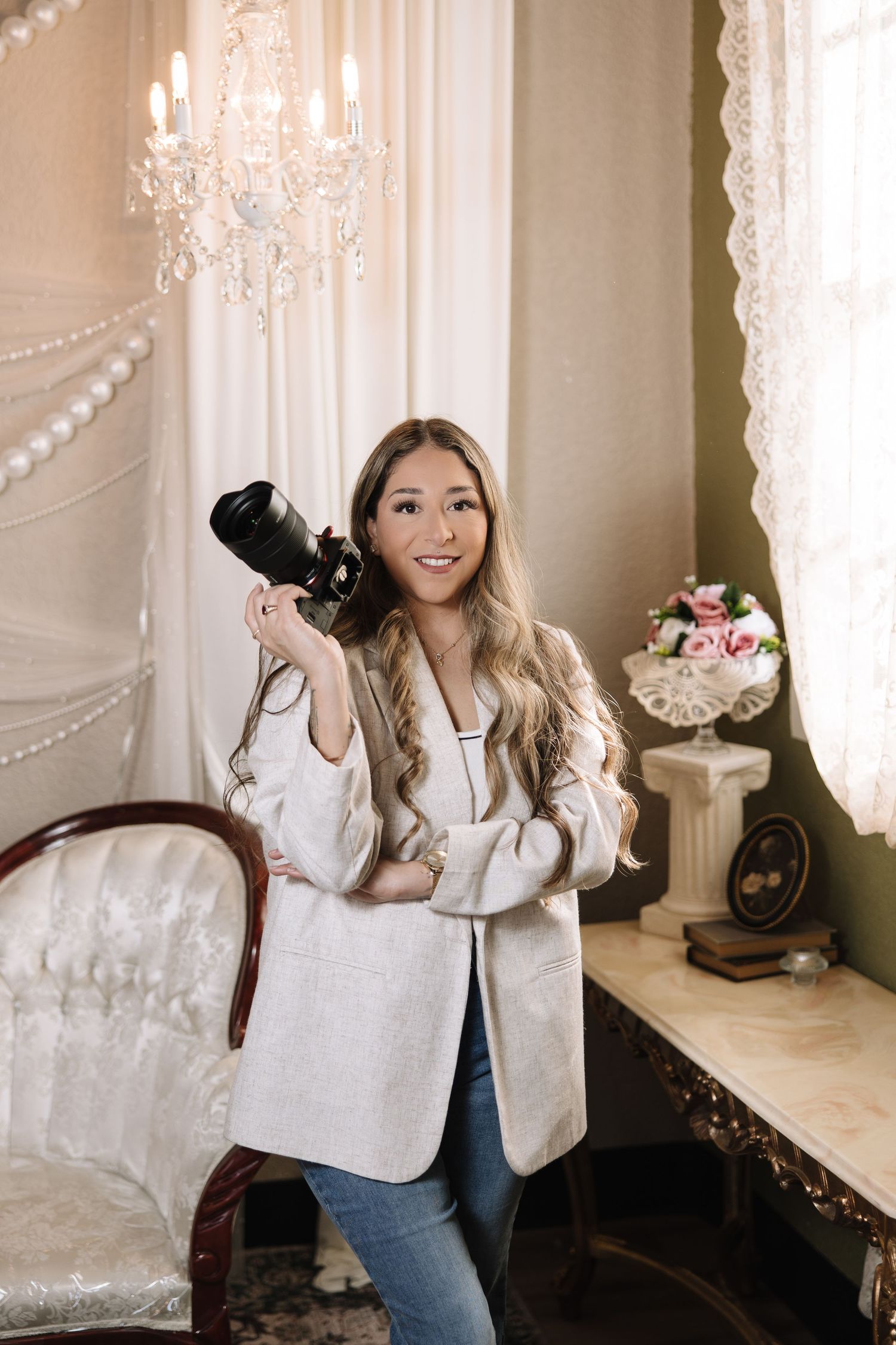 A lifestyle photo series showing a person in a white blazer and jeans posing in an elegant room with ornate decor.
