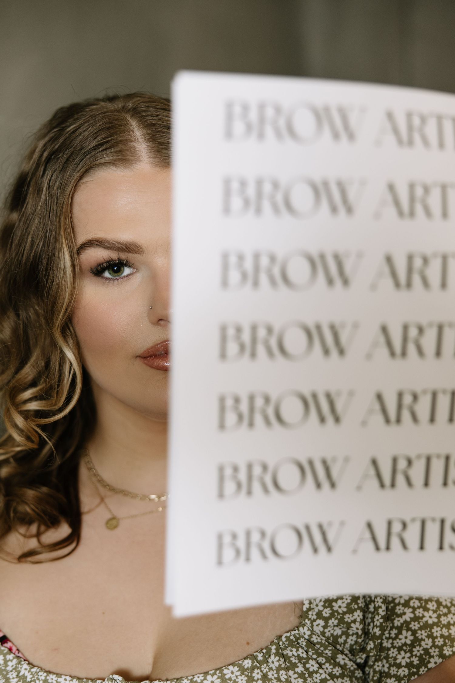 Professional branding photography with soft focus text and elegant styling.