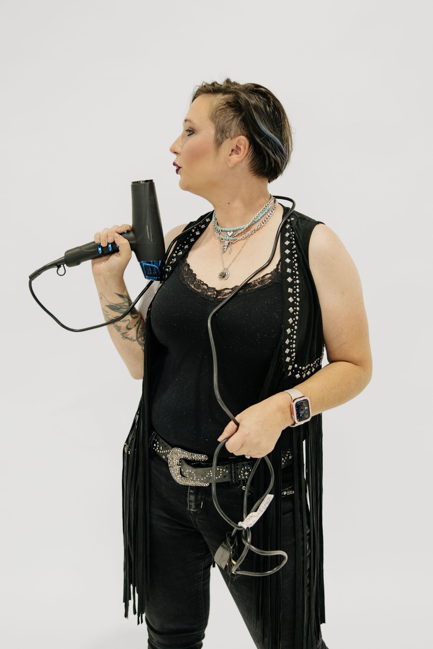 Series of poses with styling tools against white background showing edgy fashion look.