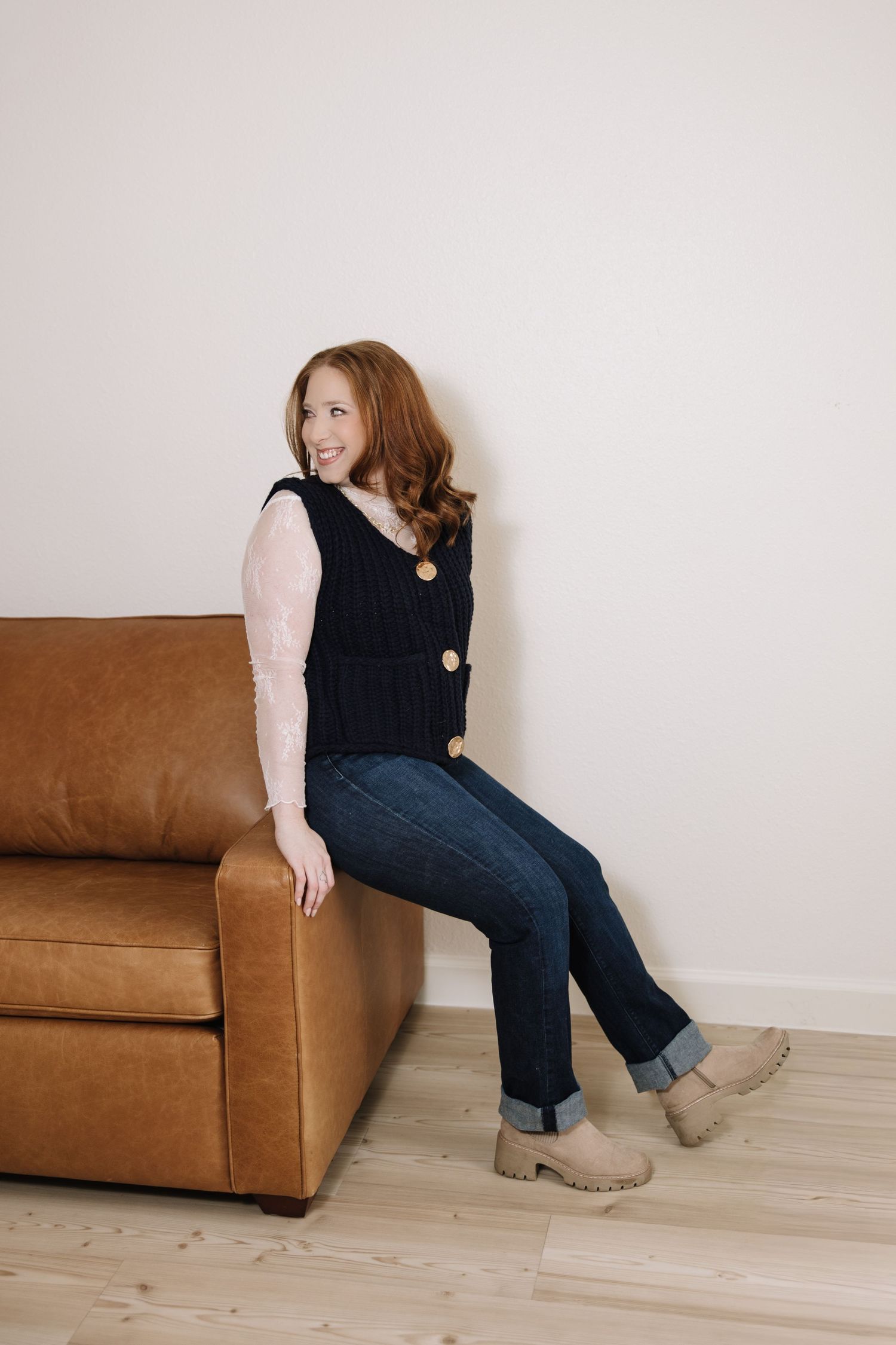 Lifestyle photos on a brown leather couch showing casual poses and relaxed styling.