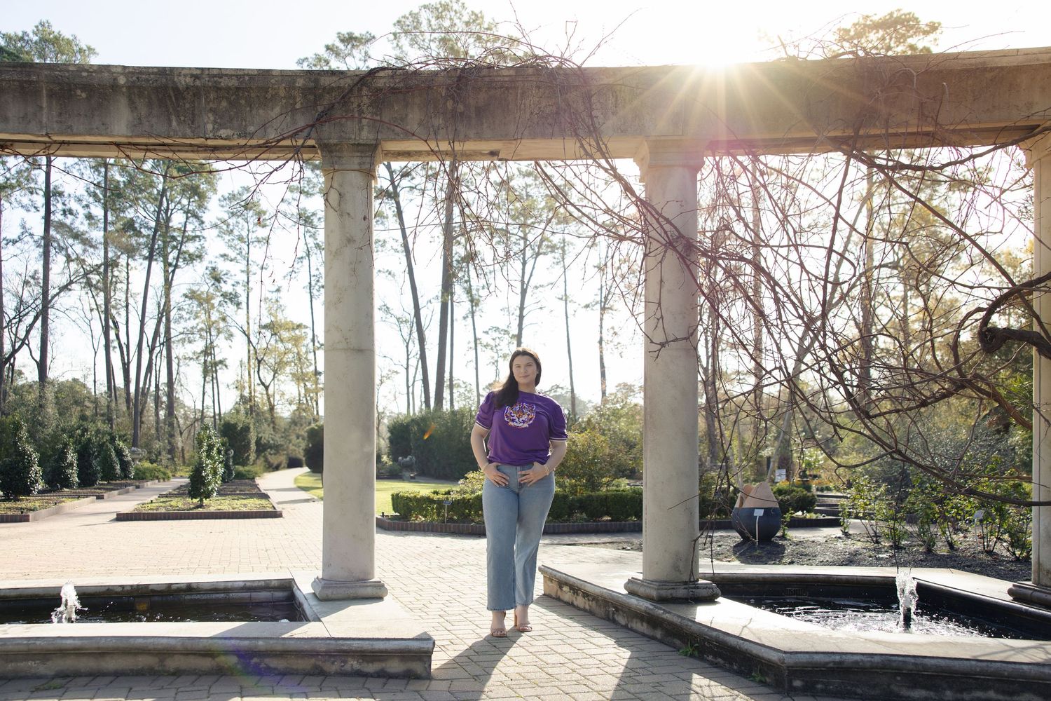 Outdoor covered walkway with columns photographed during golden hour sunset.
