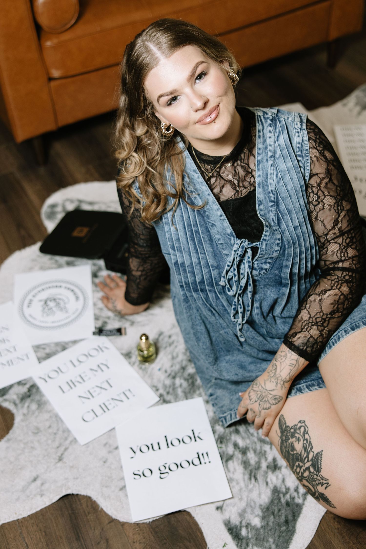 Lifestyle photography session with denim and lace outfit on textured background.