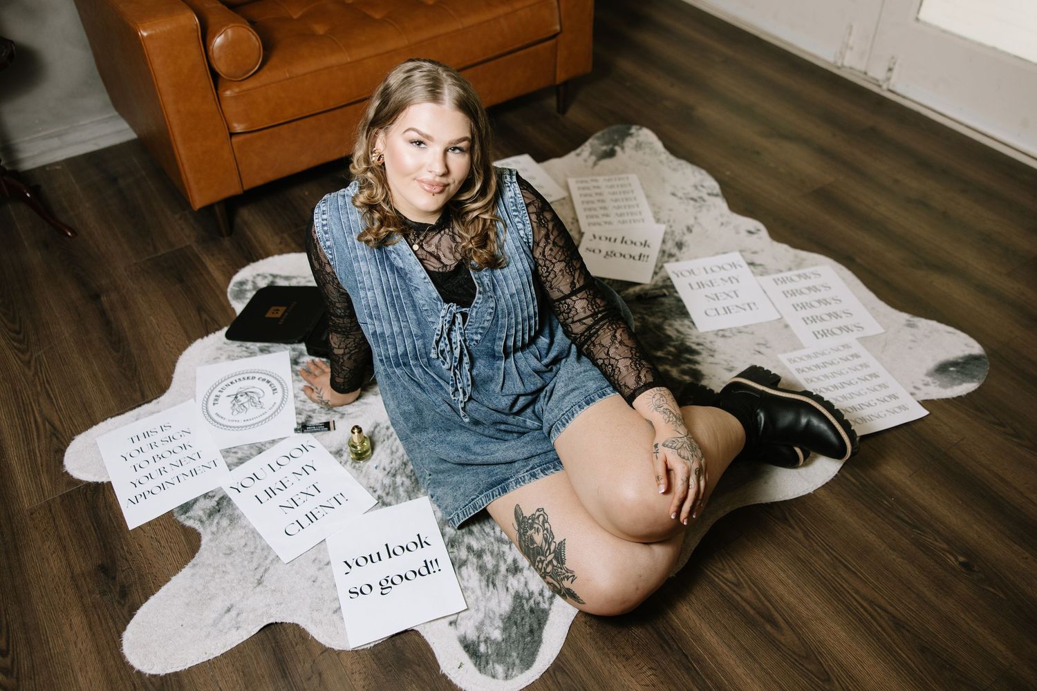Indoor lifestyle photography session with denim and paper elements.