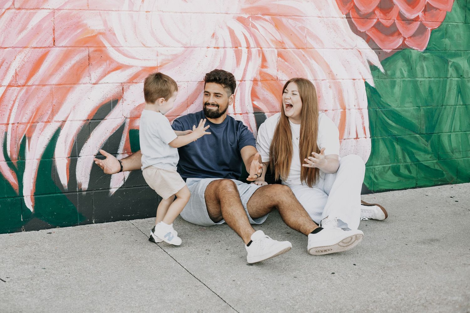 Family laughing together during family photo session by Woodbury family photographer