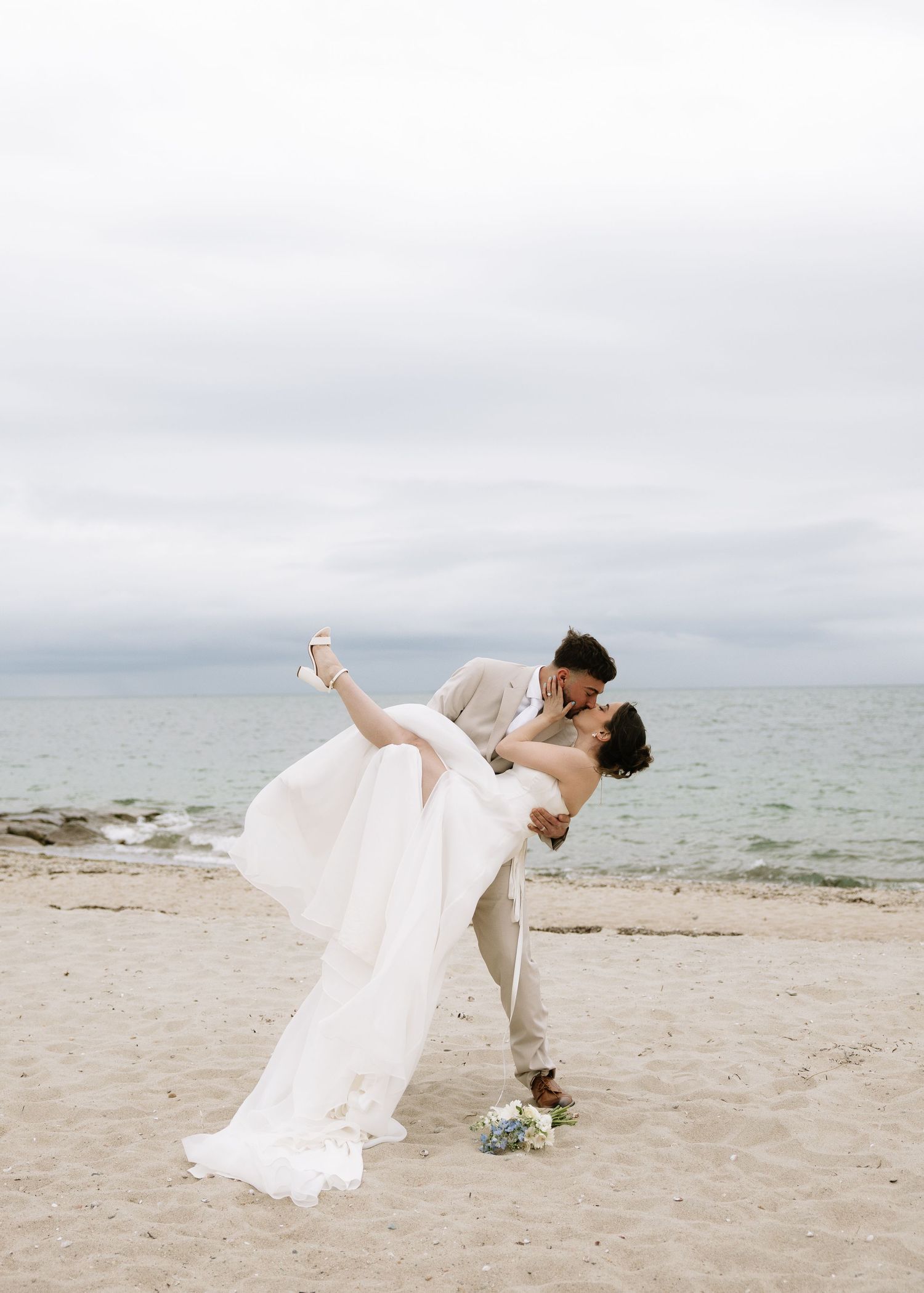 Groom holding bride on Cape Cod coastal elopement