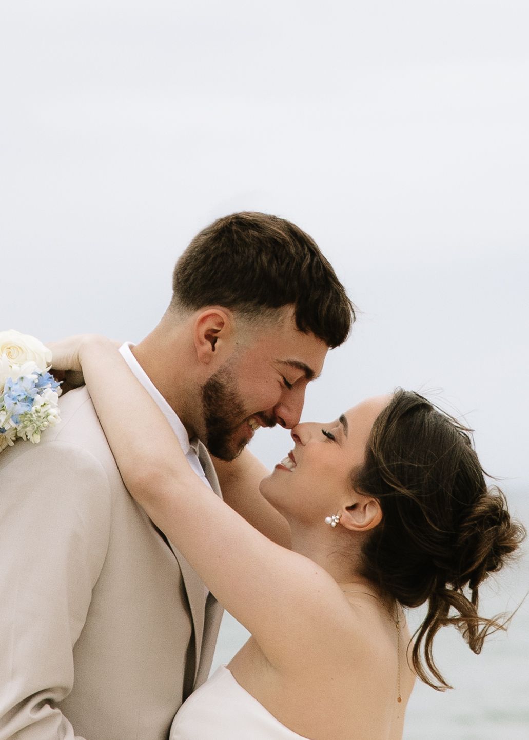 Couple on Cape Cod beach during windy coastal elopement
