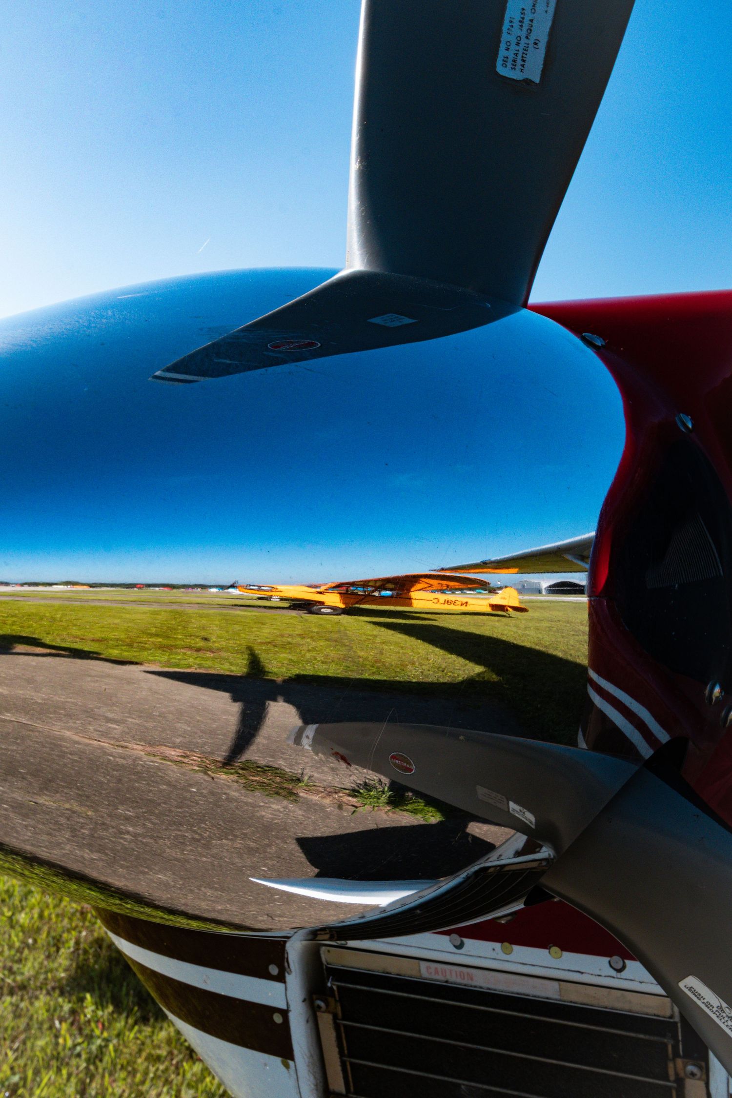 Reflection of airplane in propeller chrome