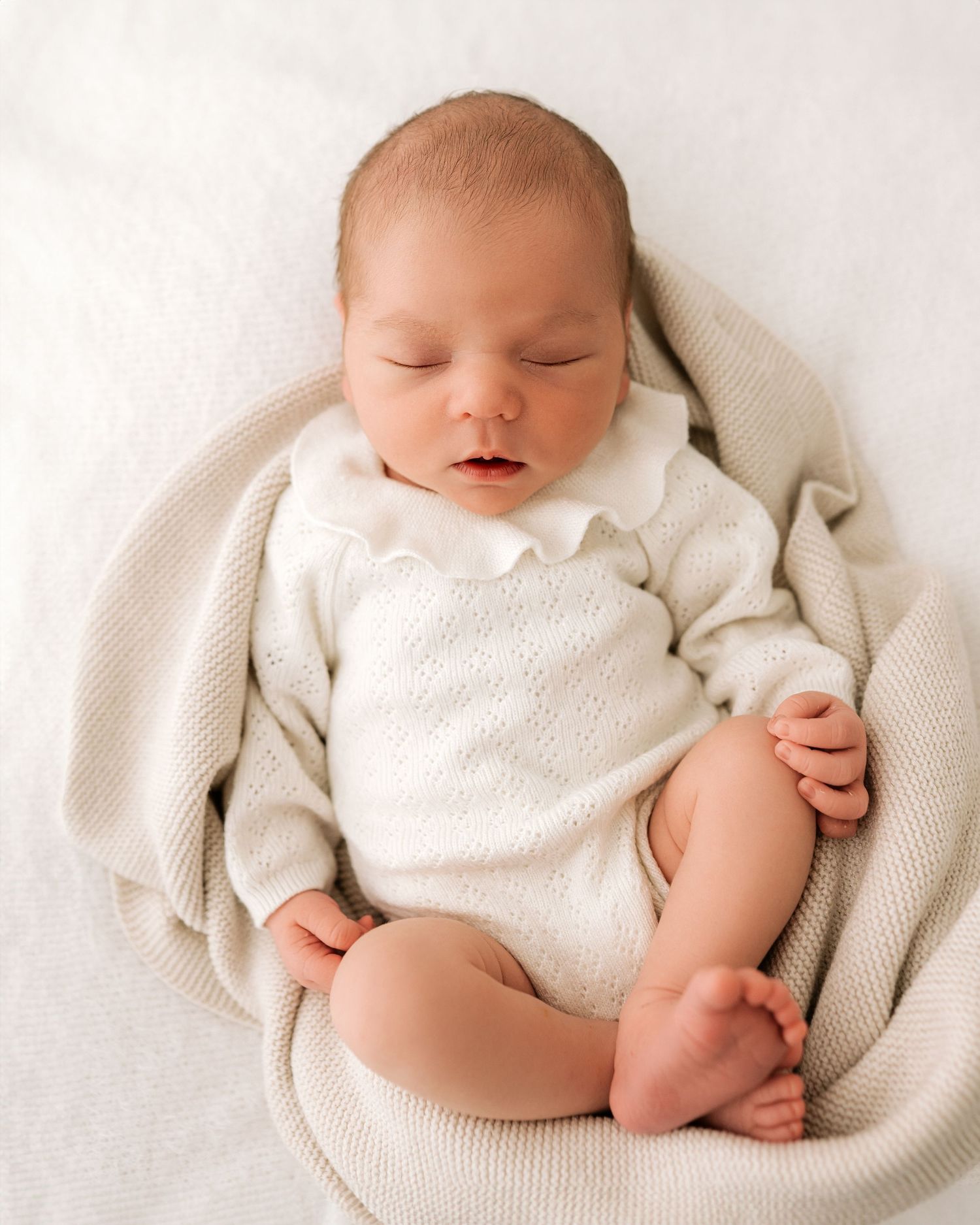 Soft, neutral and timeless newborn portrait captured in Ayrshire all-white studio during a natural newborn photoshoot