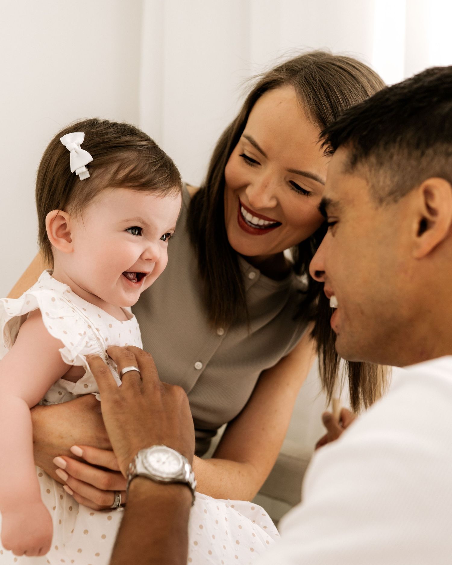a candid playful moment between this family captured naturally in Faye McRae's Ayrshire photography studio