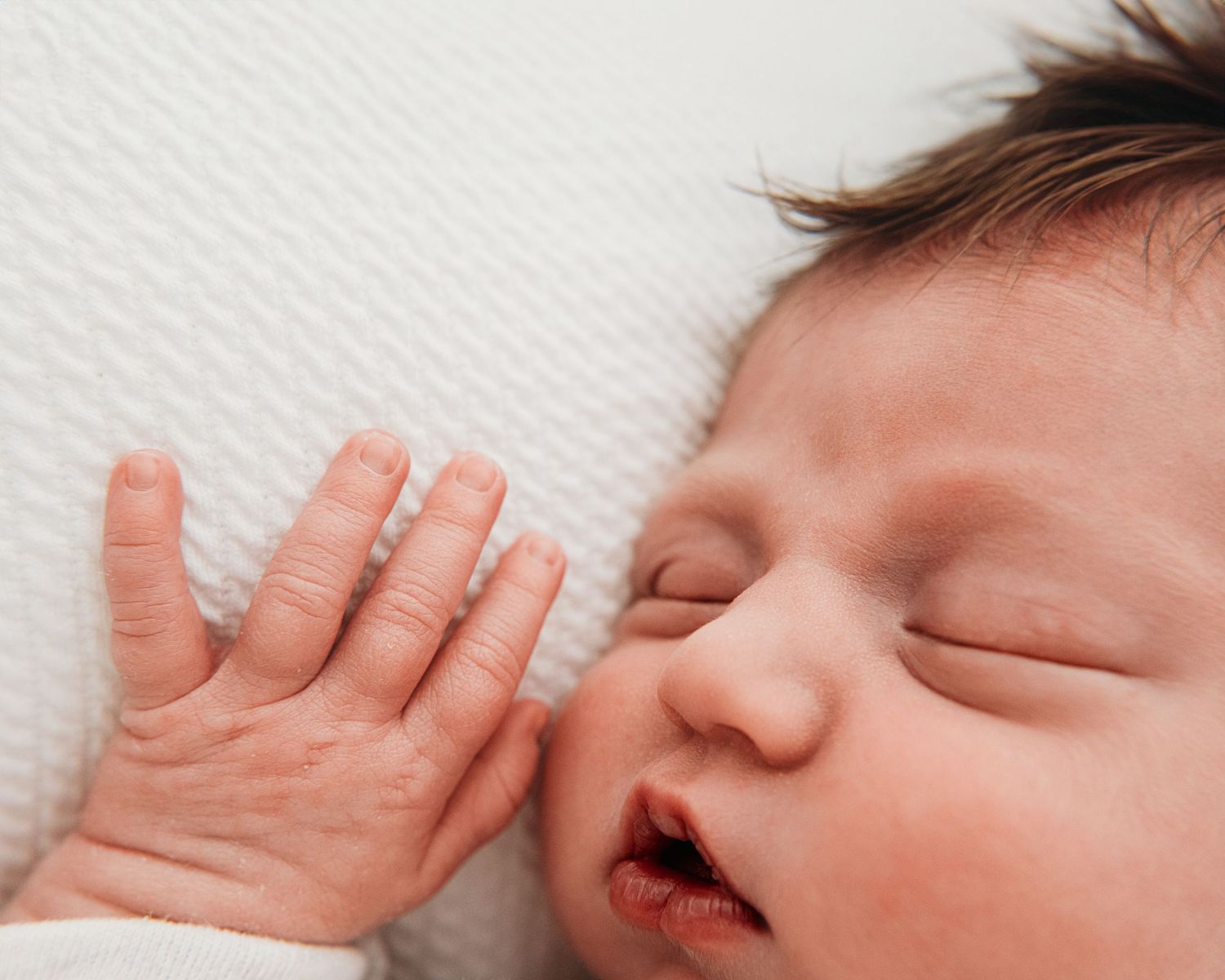 sound asleep newborn baby girl's beautiful features captured during minimalist newborn session in Ayrshire