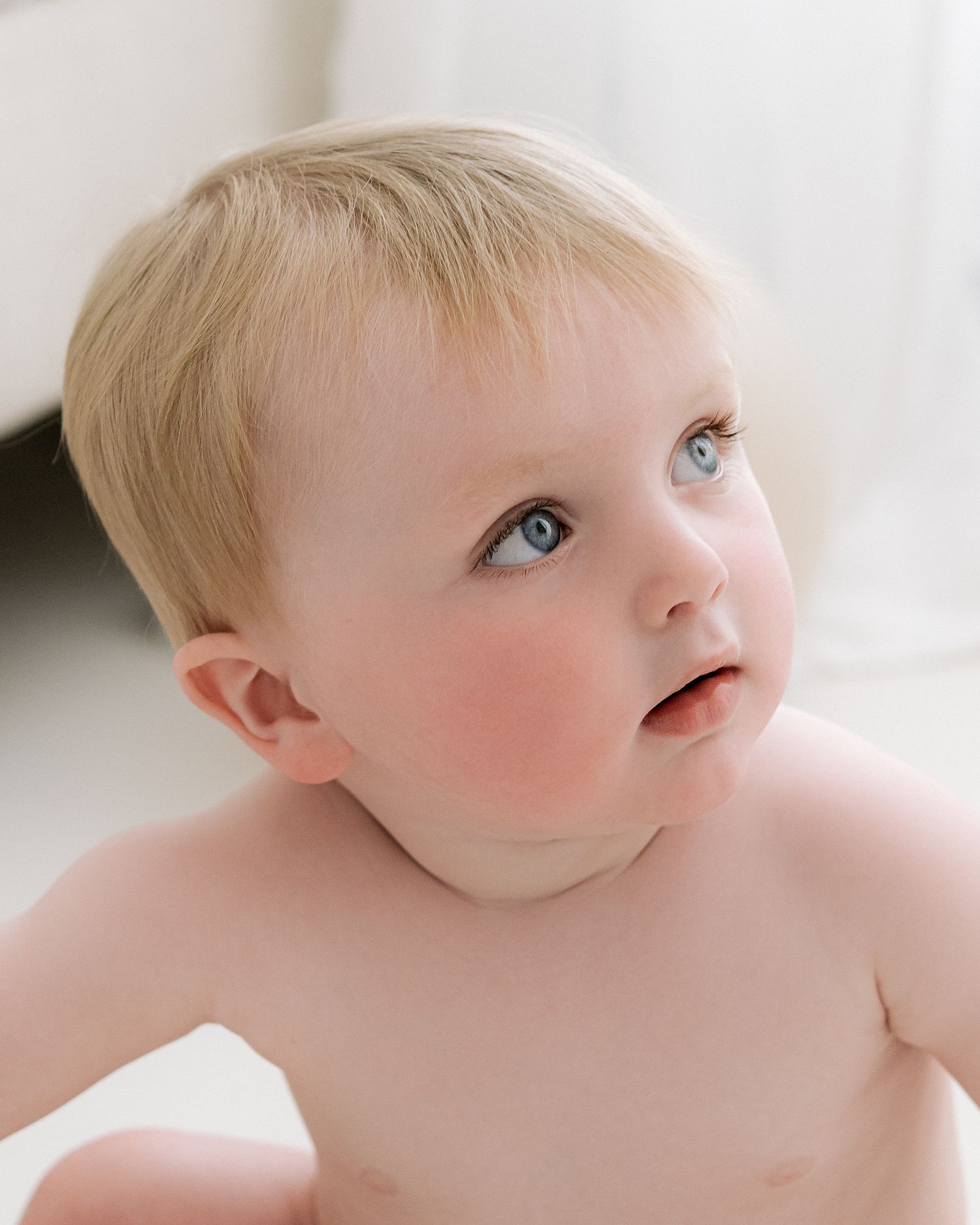 Minimalist studio portrait of baby at one year old by simple and timeless Ayrshire family photographer