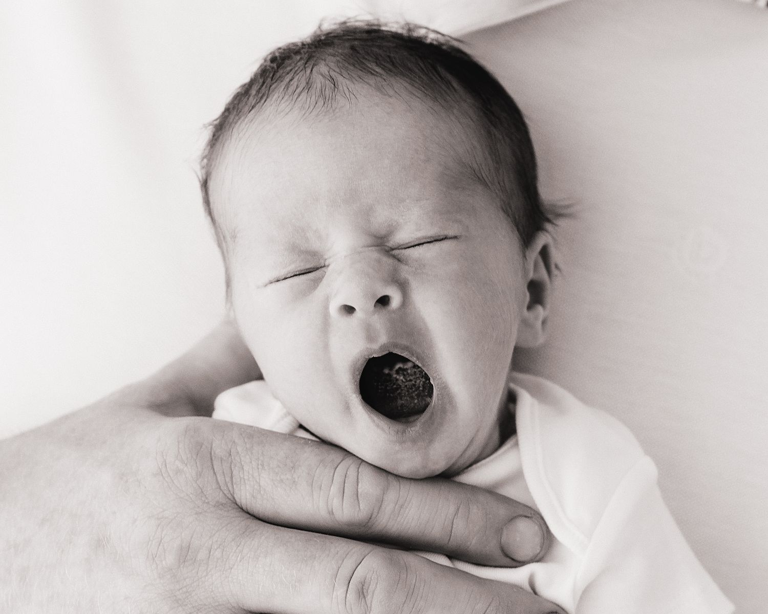yawning newborn baby captured naturally during newborn session in South Ayrshire by photographer Faye McRae