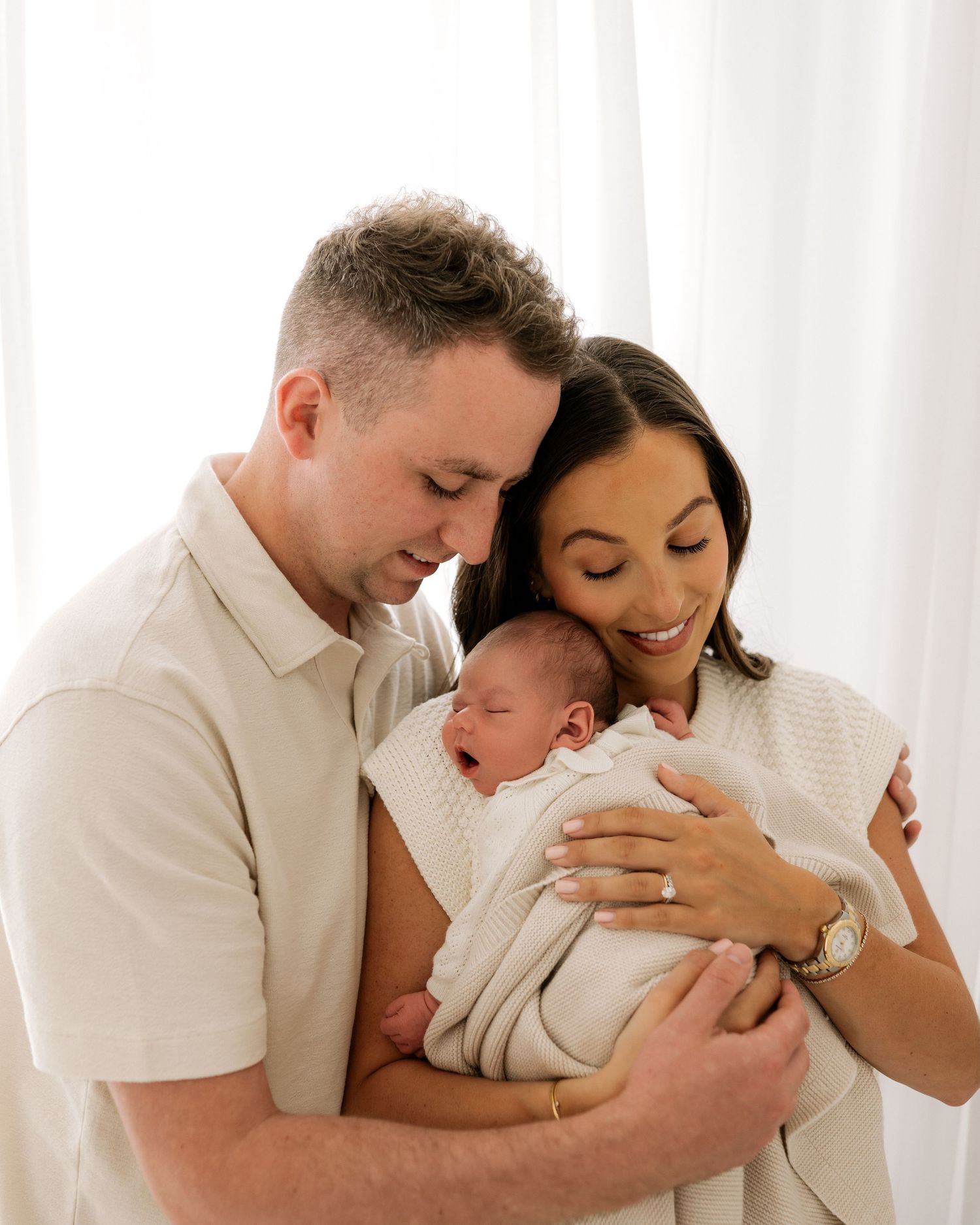Ayrshire natural newborn photoshoot creates a timeless family portrait, new parents soaking up every moment with their new love