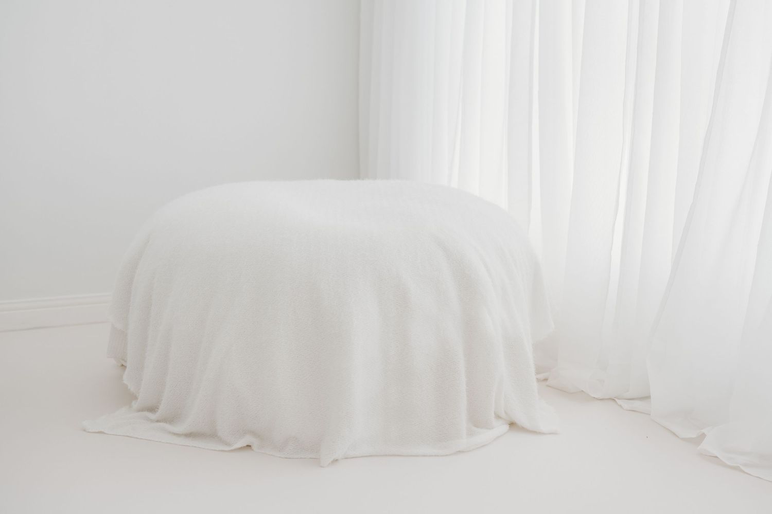 All-white photography studio, located just outside Ayr, Scotland where timeless, authentic memories are captured by photographer Faye McRae