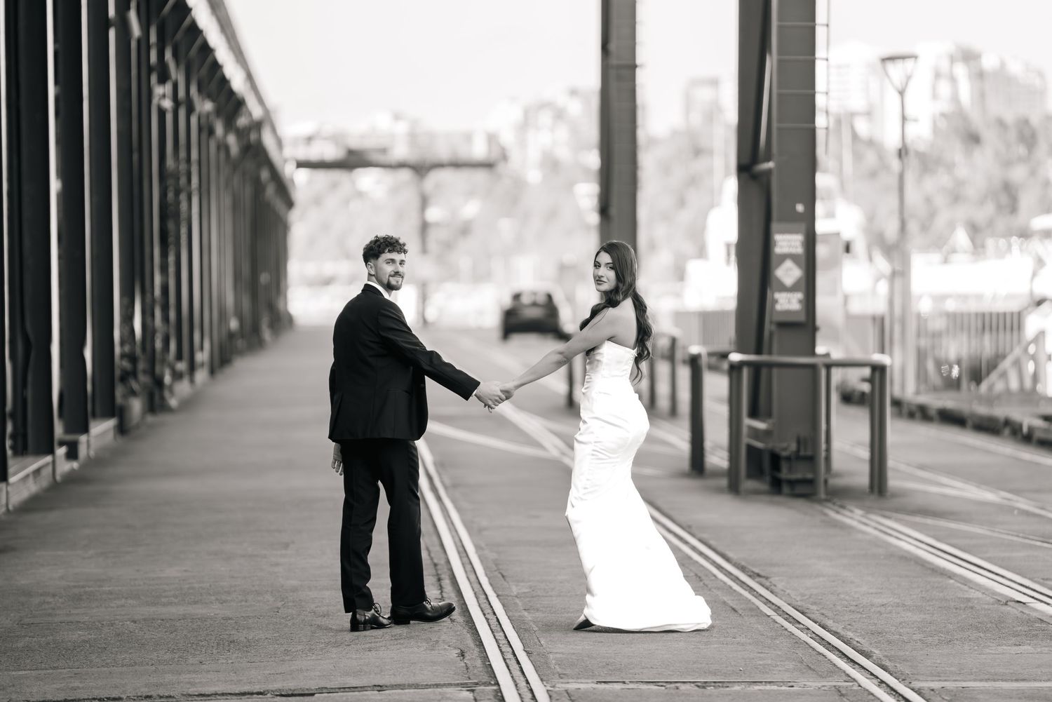 A series of black and white photographs showing people in various poses on a boardwalk or pier.