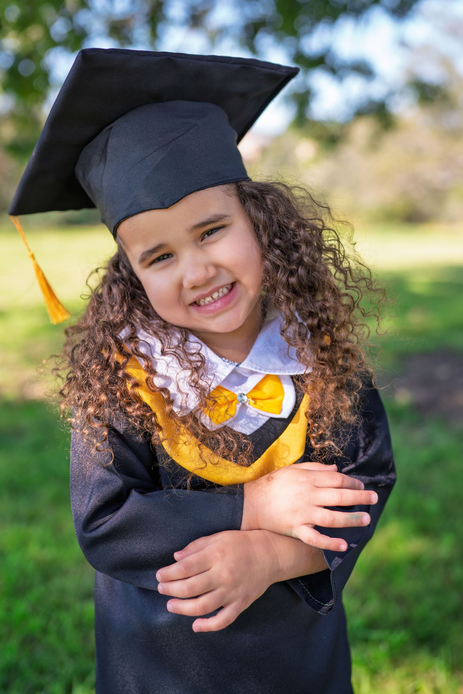 Four sequential photos show a young graduate in cap and gown expressing joyful emotions against a blurred outdoor background.
