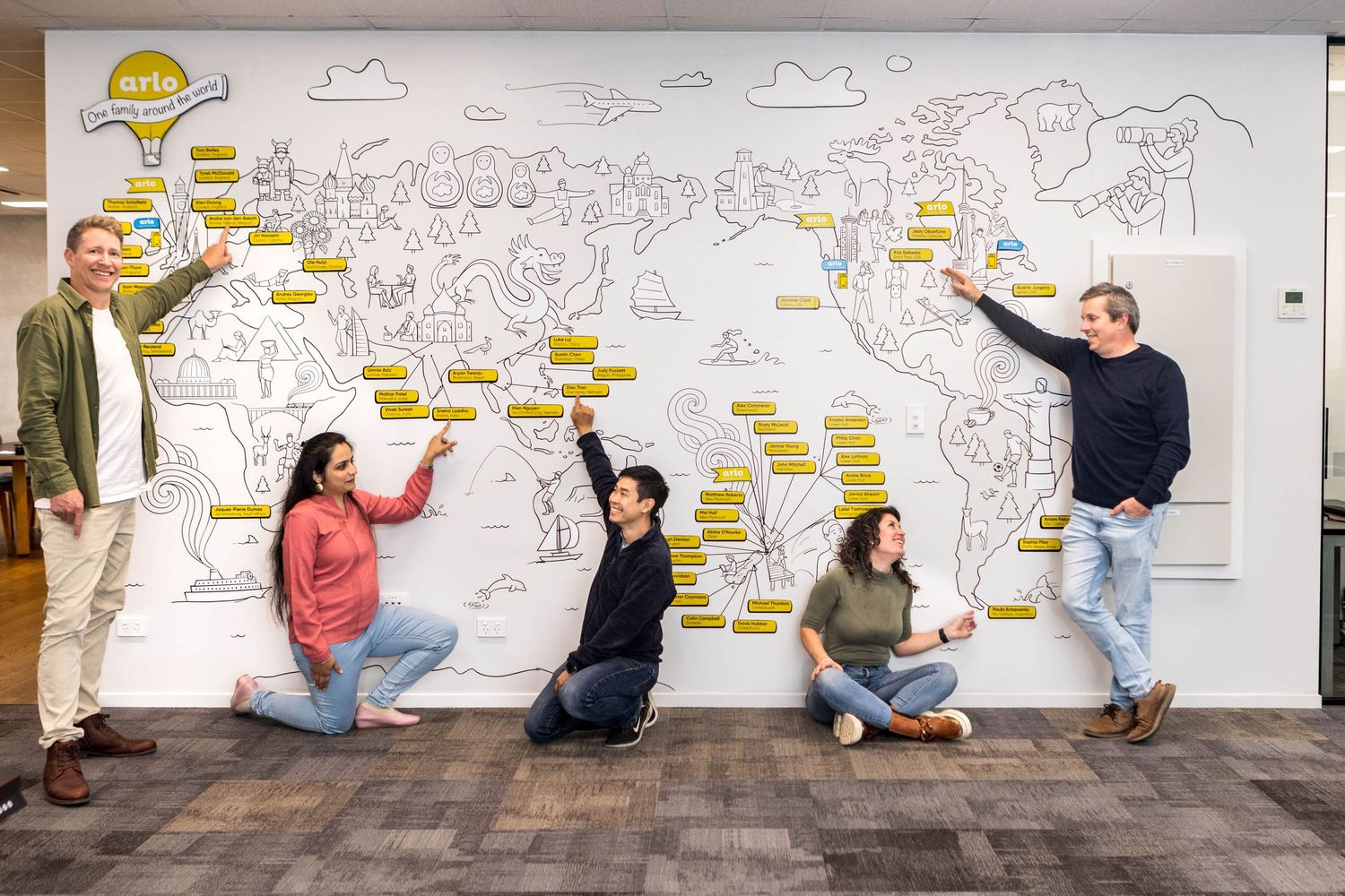 Large white wall at Arlo office with large map.