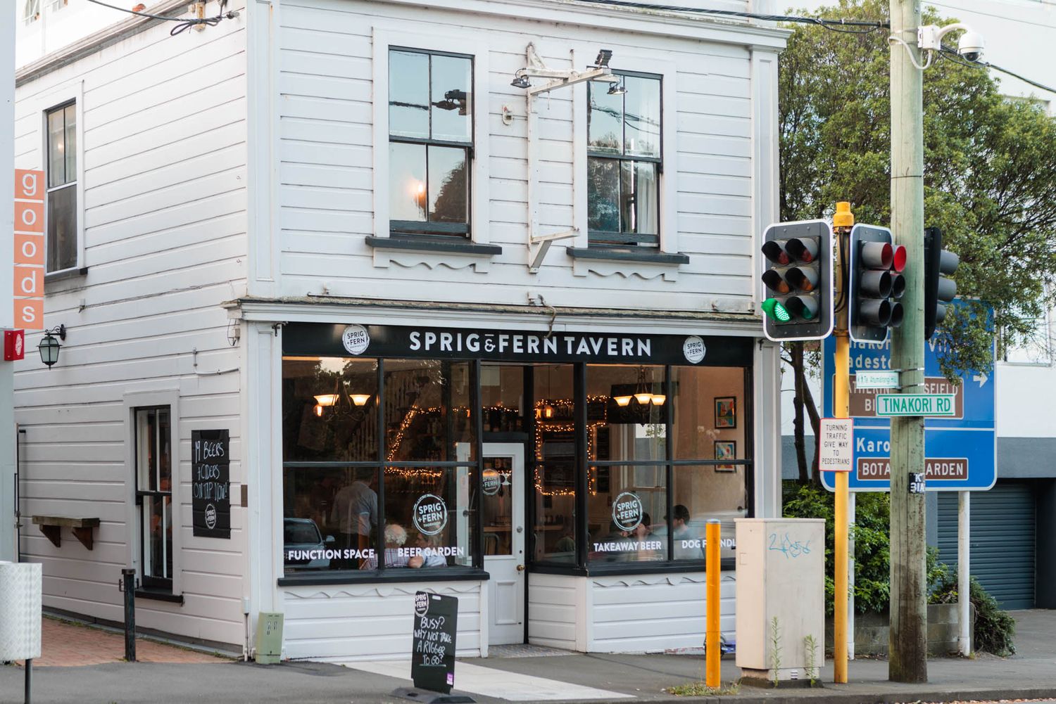 Corner view of Sprig and Fern Thornton with vintage style windows and signage.