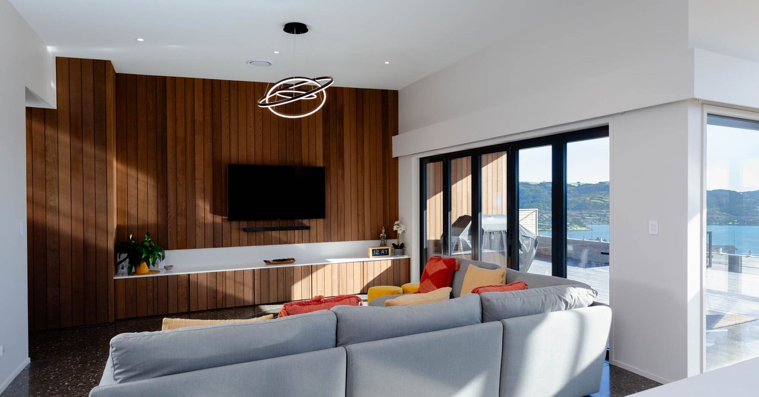 Sleek modern living room in an open-concept layout.