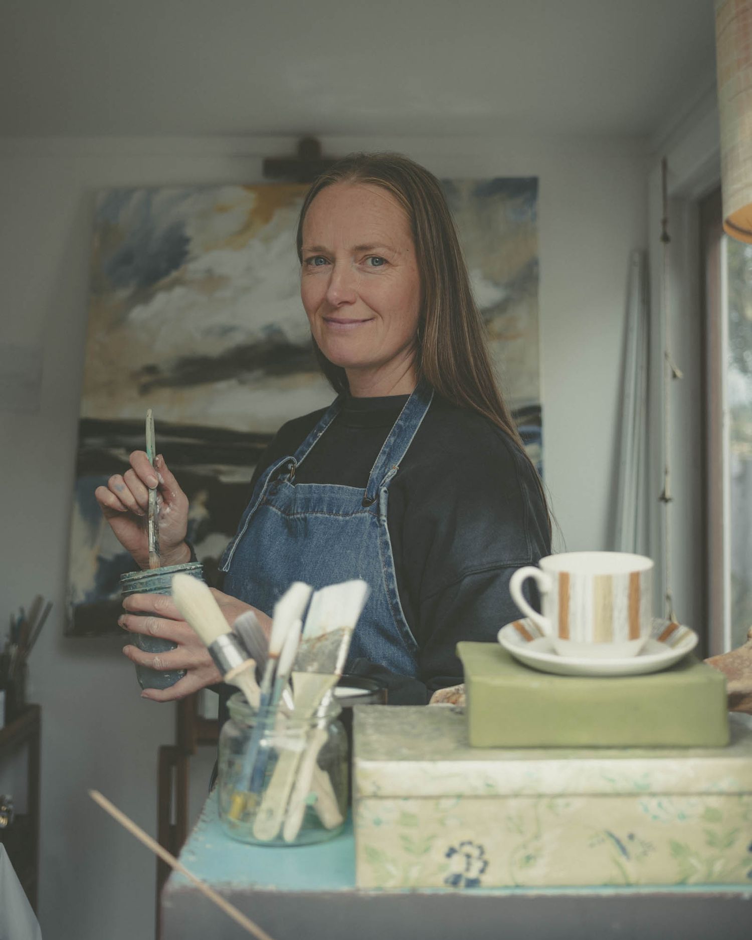 Portrait of artist with paints.