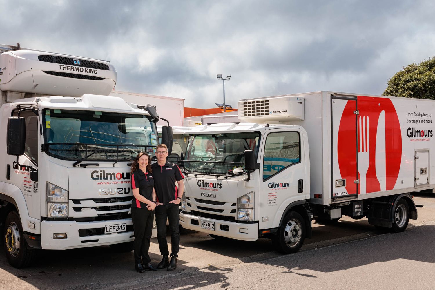 Delivery trucks and staff from Gilmours food service company.