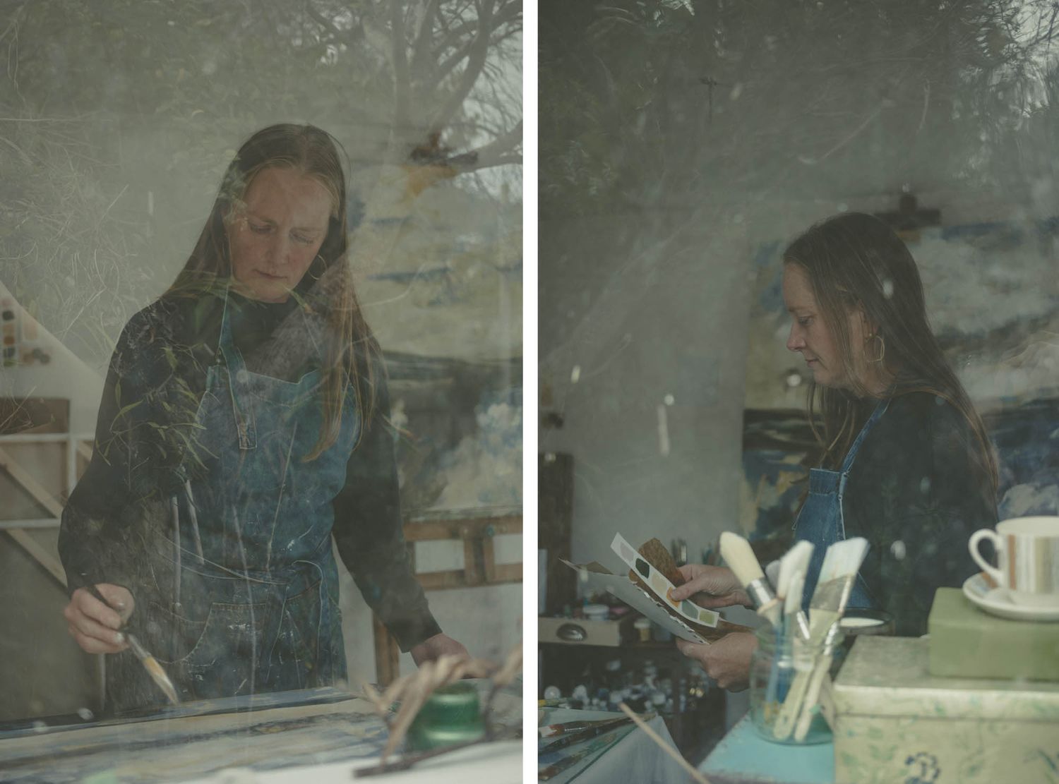 Artist working on projects in a studio space shown through reflective glass.