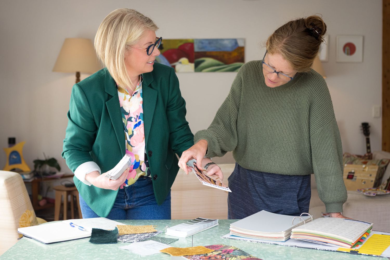 Interior design working session by Homes with Soul with notebooks and materials spread out.