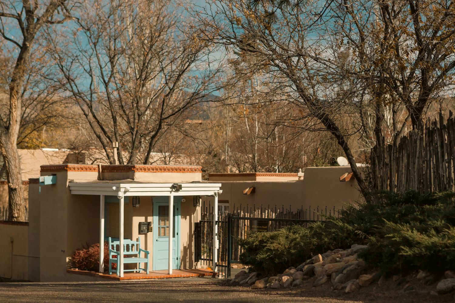 Panoramic view of adobe buildings and bare trees in Santa Fe.