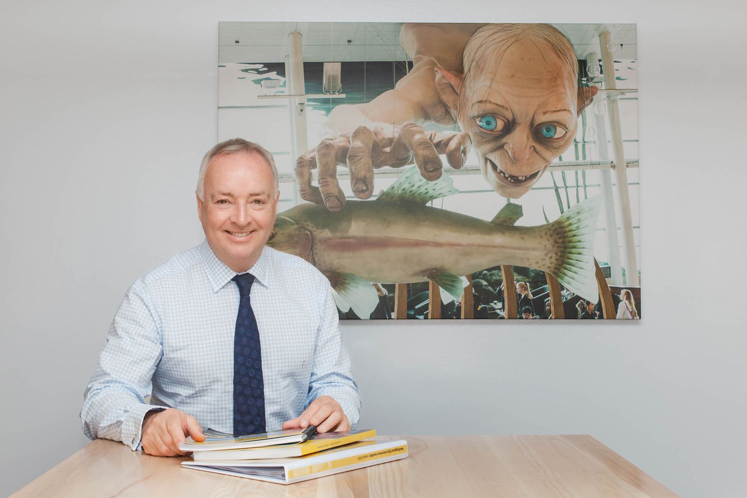 Kevin Lavery Wellington City Council CEO at a desk with large wall art in an office setting.