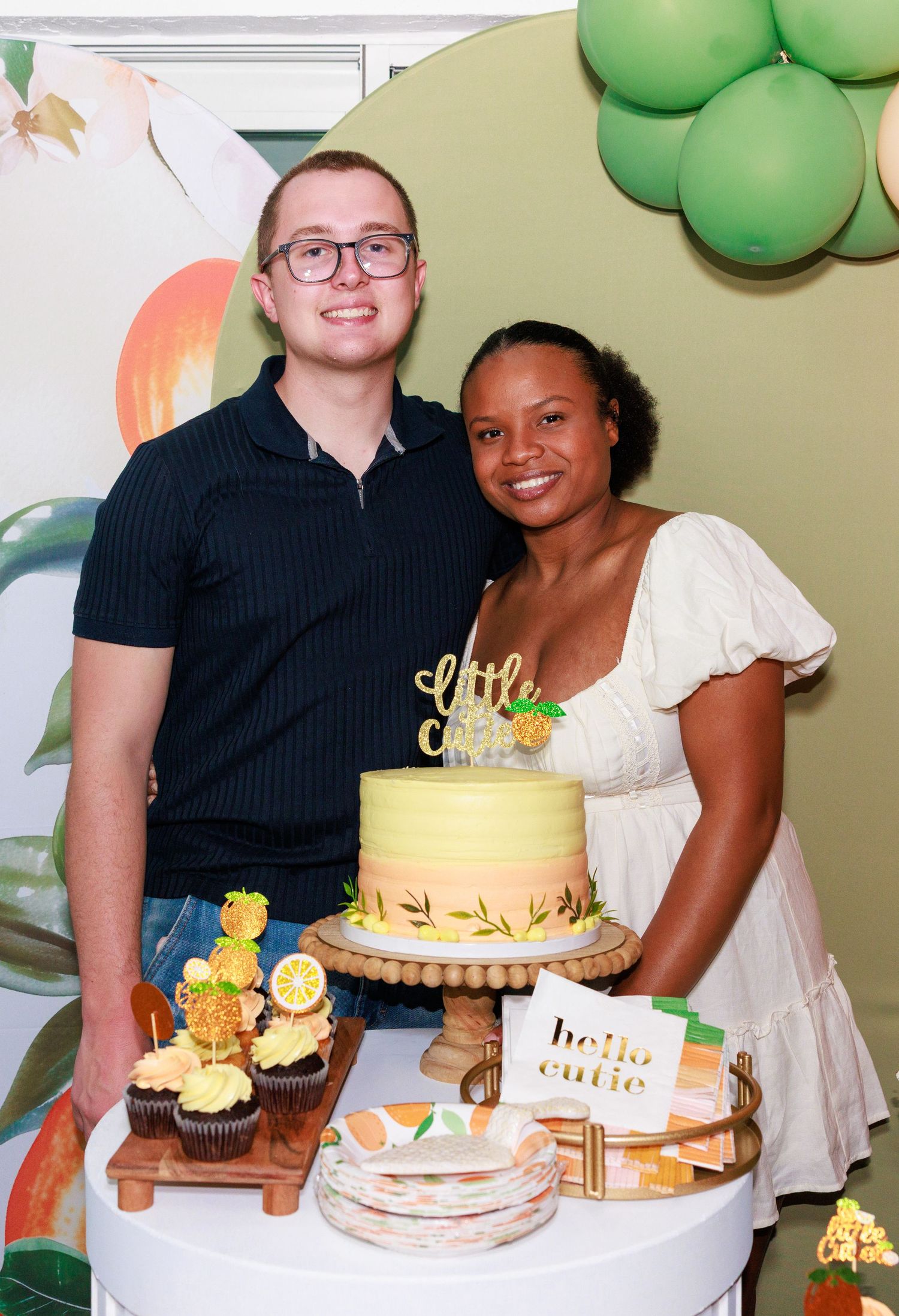 A series of four photos showing a festive celebration with green balloons, yellow cupcakes and a decorated cake.