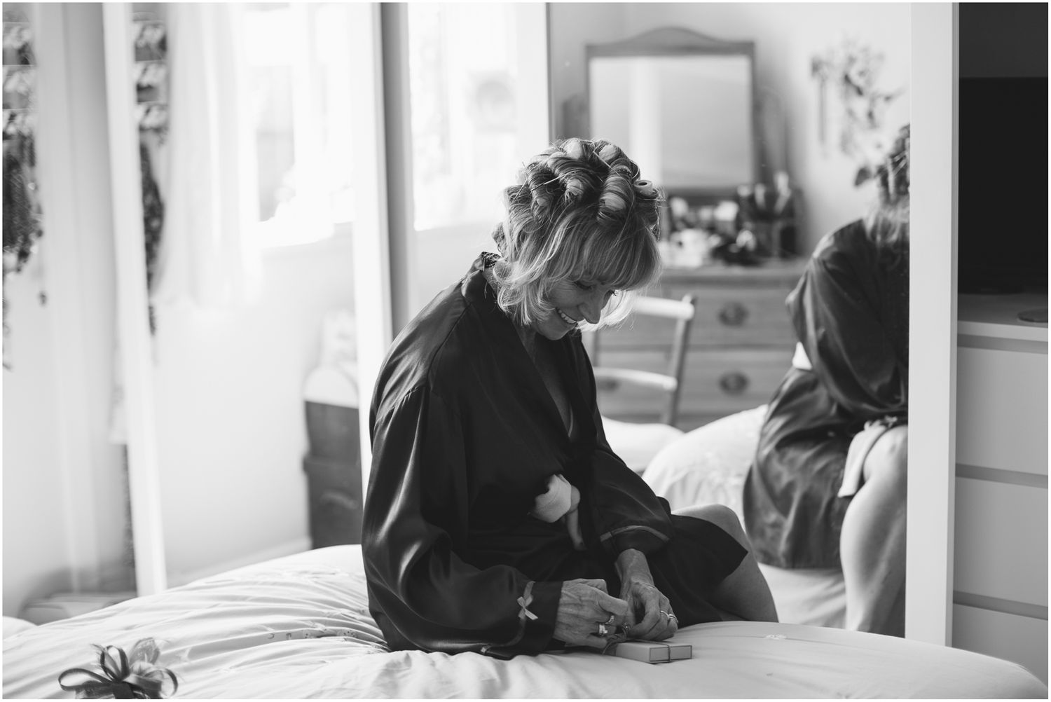 Black and white photographs showing intimate conversations in a home setting.