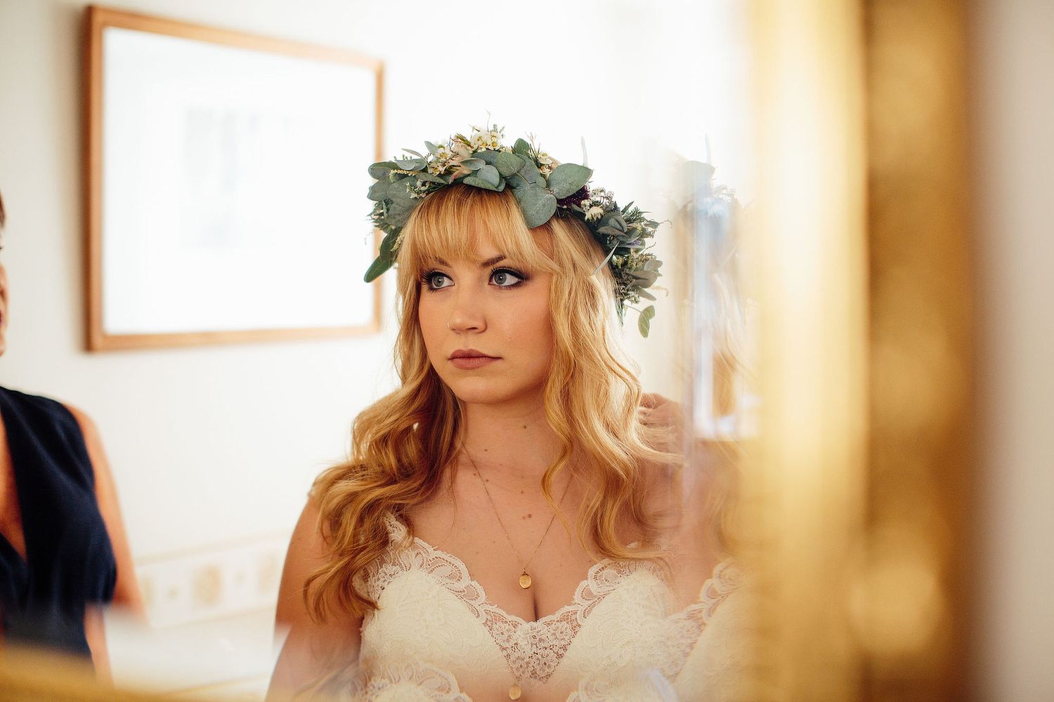 Soft-focus shots showing someone wearing a floral crown in warm lighting.
