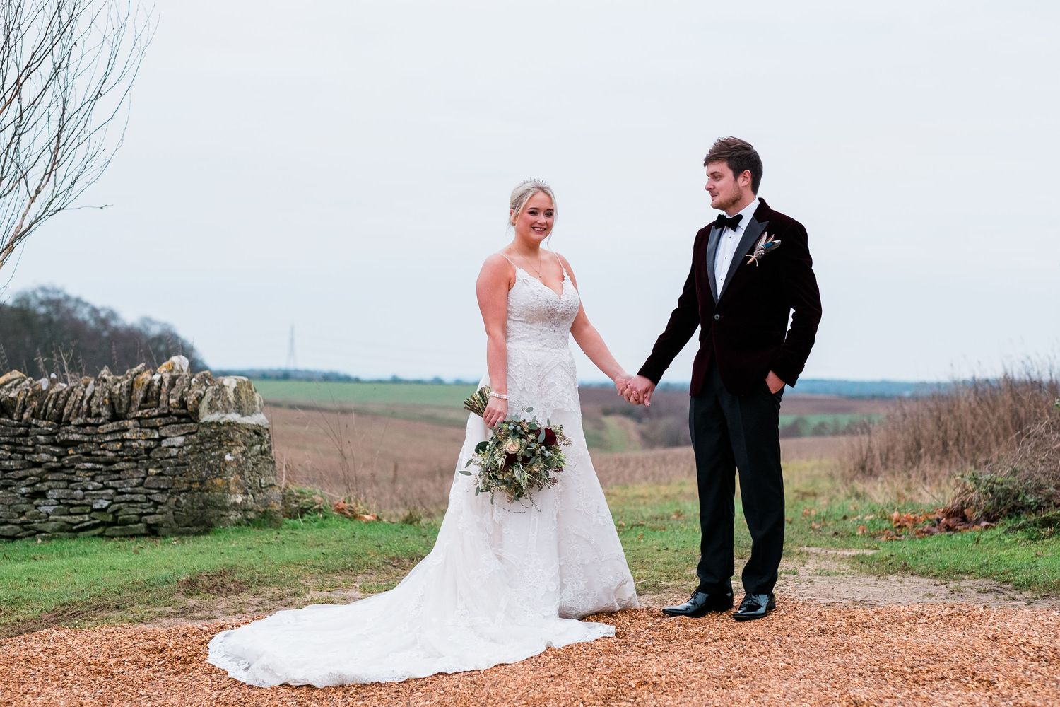 A series of romantic wedding photos taken outdoors against a rustic countryside backdrop with rolling hills.