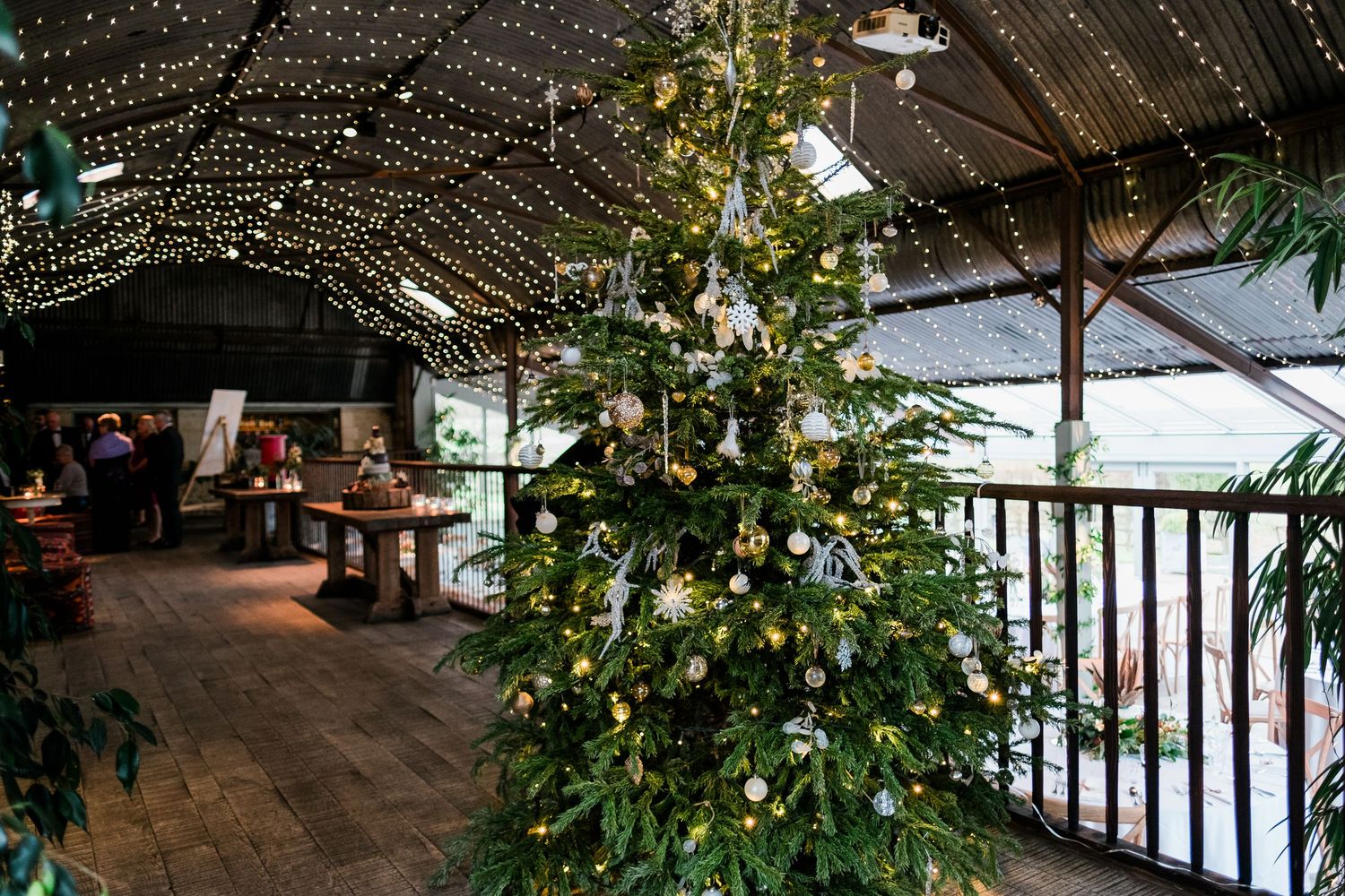 Wedding venue decorated with fairy lights and greenery creating a romantic atmosphere.