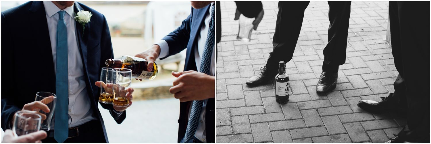 Wedding party members in formal attire standing on brick pavement.