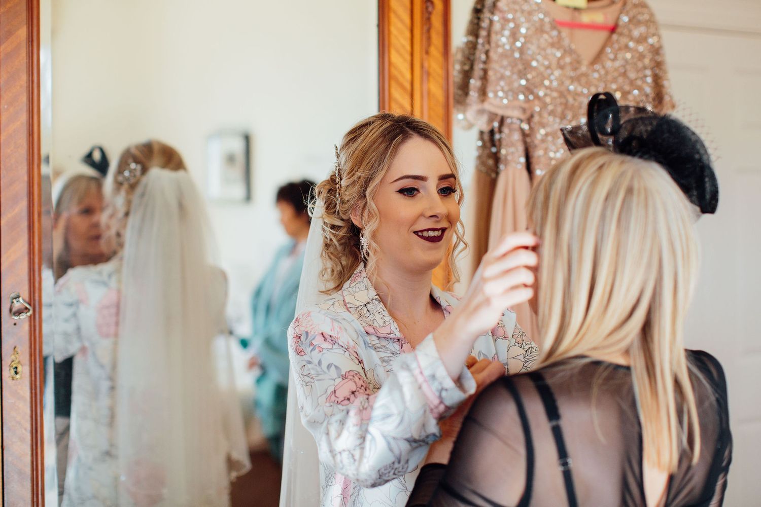 Wedding party celebrating and laughing together during pre-ceremony preparations.