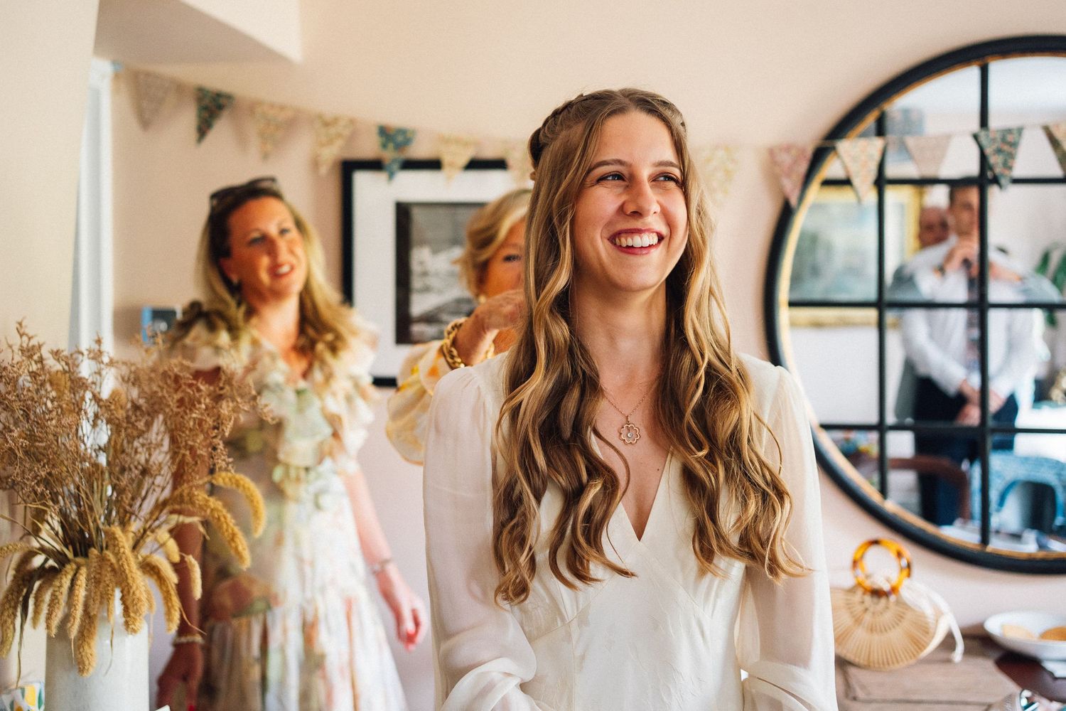 A series of lifestyle photos showing someone in casual attire posing and smiling in a bright interior setting.