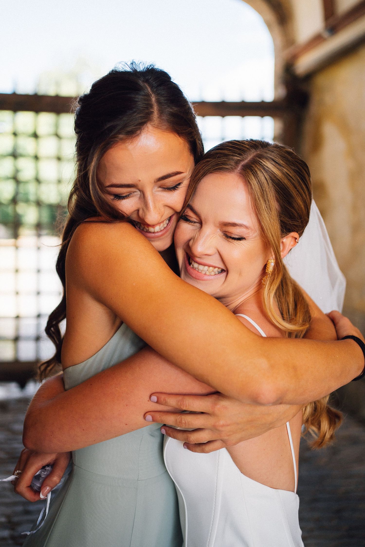 A sequence of candid emotional moments showing two friends sharing warm embraces in natural lighting.