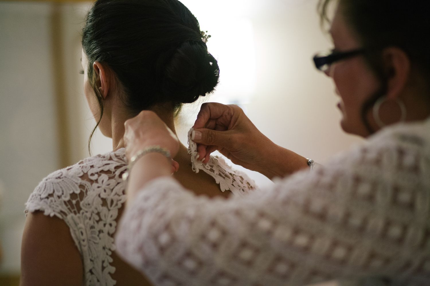 Getting ready scene with lace details and soft morning light.