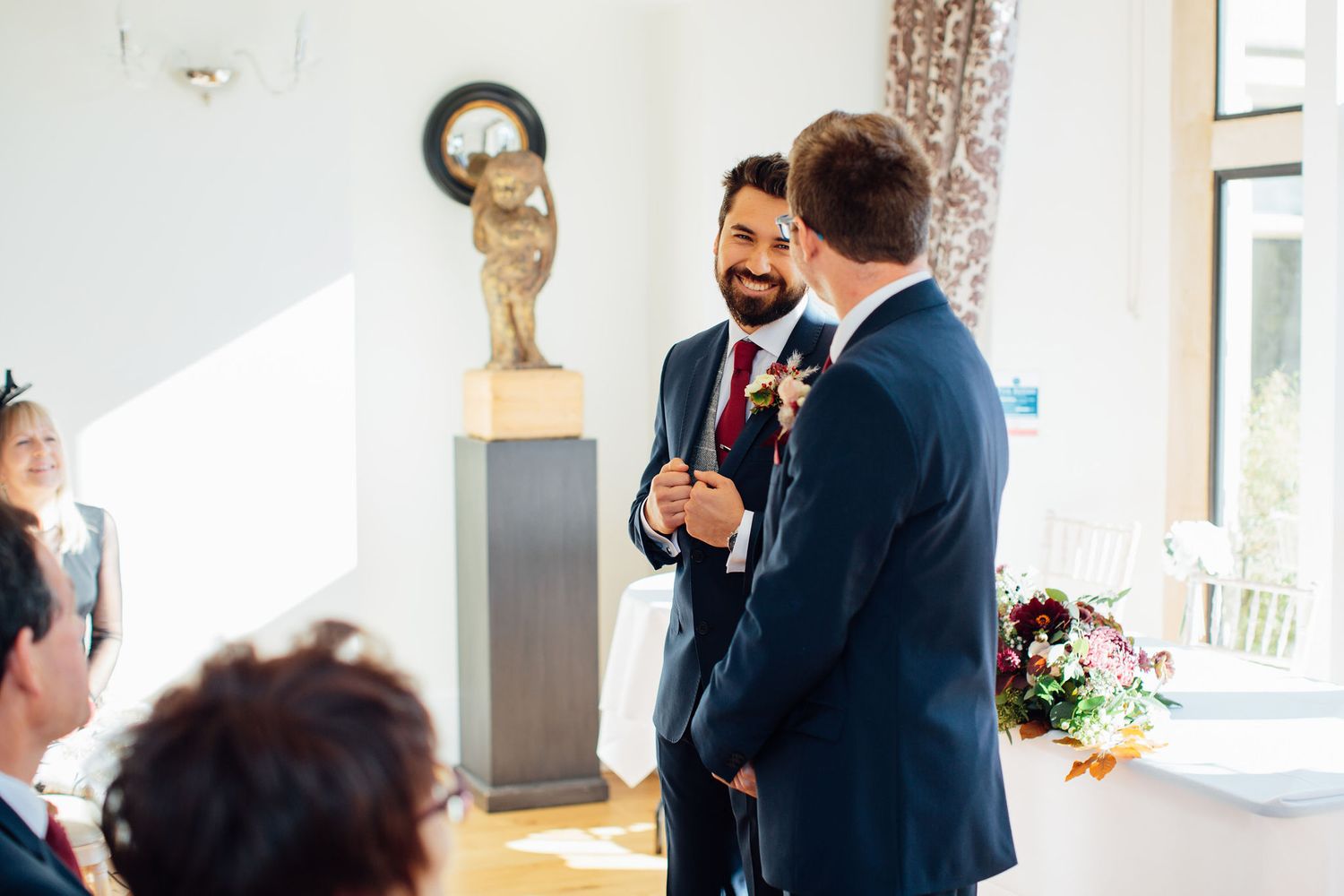 Wedding celebration candid moments captured in a bright indoor venue.