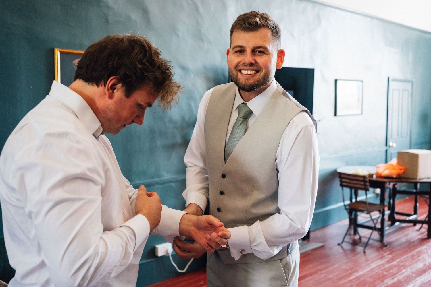A series of candid moments showing a couple signing documents in an office setting.