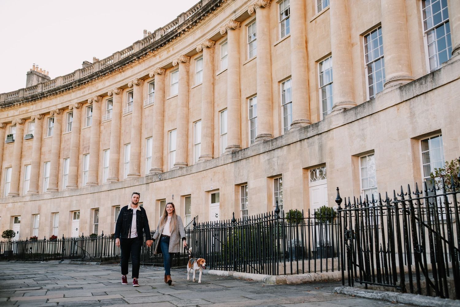 Historic Royal Crescent in Bath with its iconic Georgian architecture and curved limestone facade stretches across the frame.