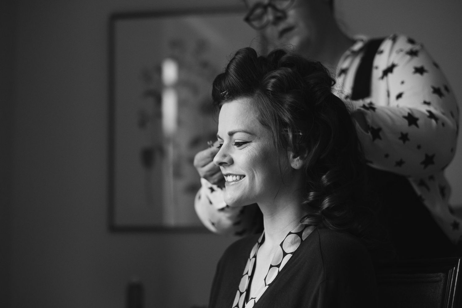 Dramatic black and white portraits showing emotional moments at a wedding celebration.