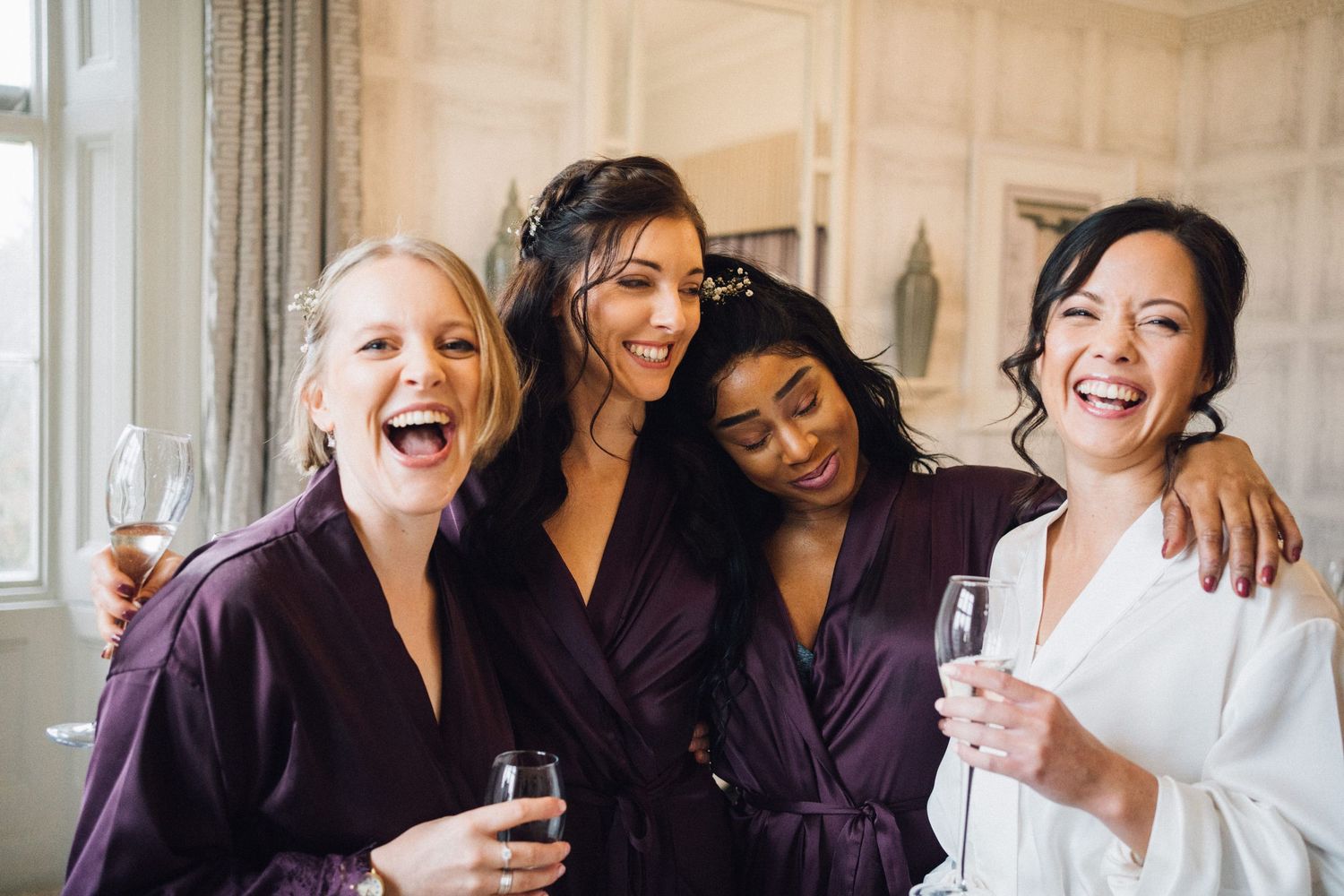 Joyful celebration moments captured during wedding morning preparations.