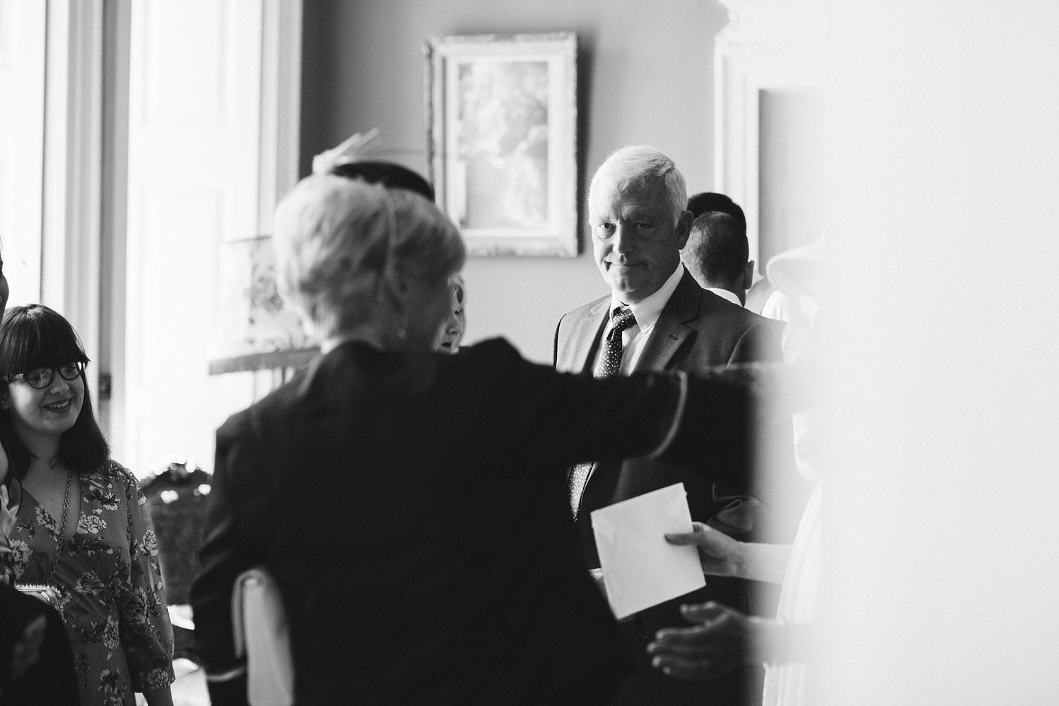 Intimate black and white moments captured during wedding preparations.