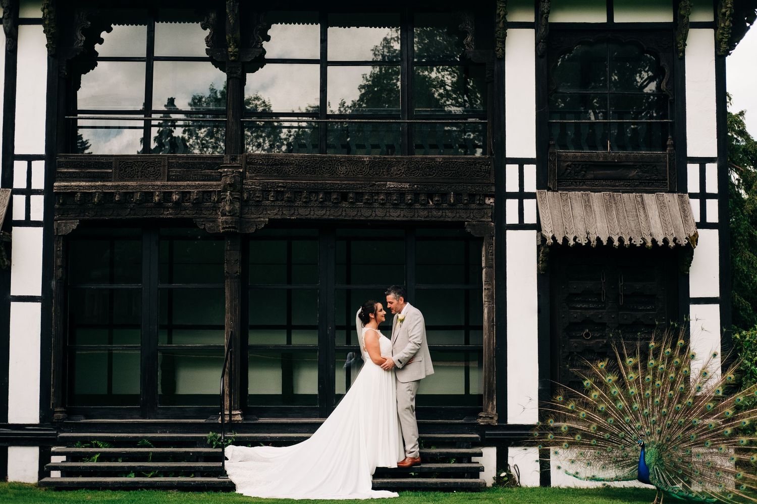 Wedding venue exterior showcasing traditional architecture and garden setting.