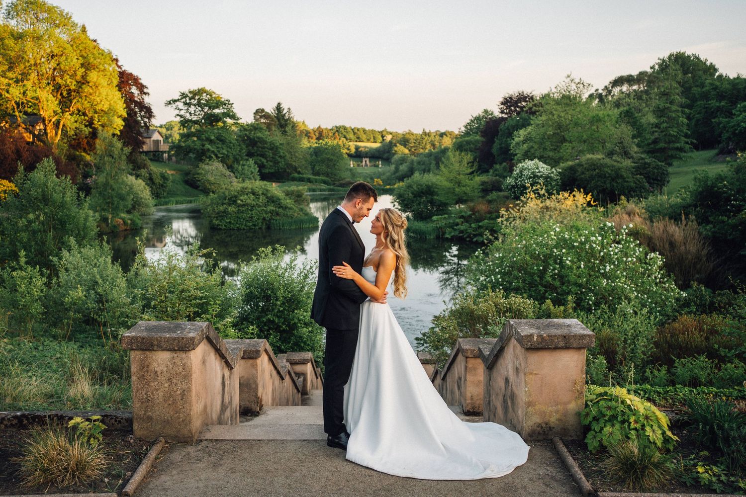 Couple holding each other during sunset at Bristol Wedding