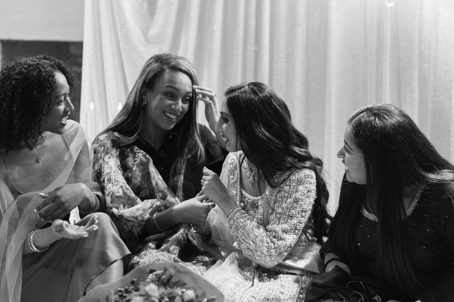 Candid shots of guests laughing and socializing at formal celebration.