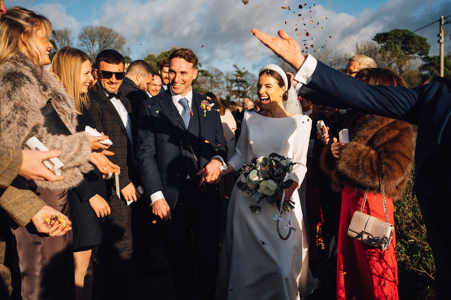 A sequence of candid wedding party photos showing joyful dancing and celebration moments at an outdoor reception.